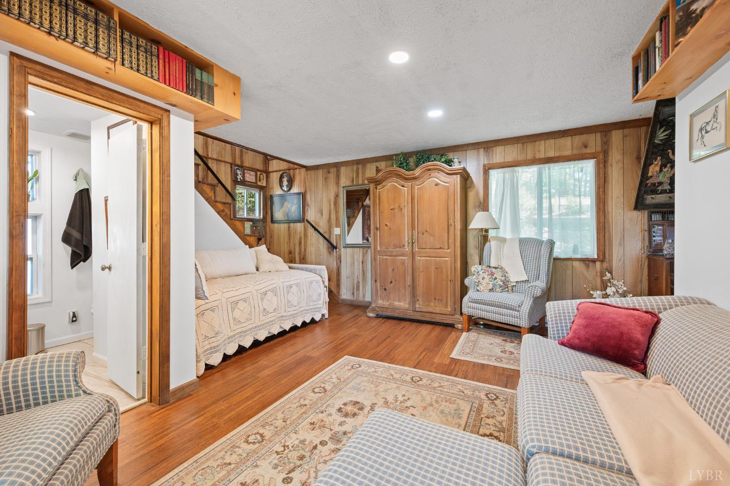 1451 Trellis Ridge Drive Lynch Station, VA 24571 - Photo 22 of 42 a bedroom with furniture and a wooden floor