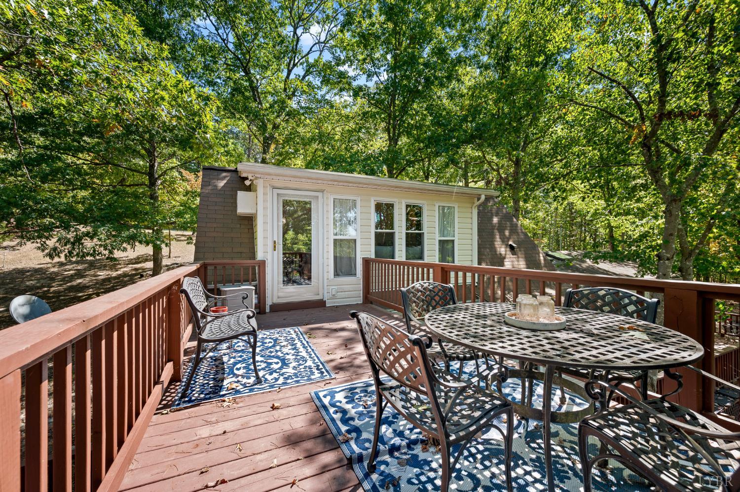 1451 Trellis Ridge Drive Lynch Station, VA 24571 - Photo 32 of 42 a view of a roof deck with table and chairs and wooden floor