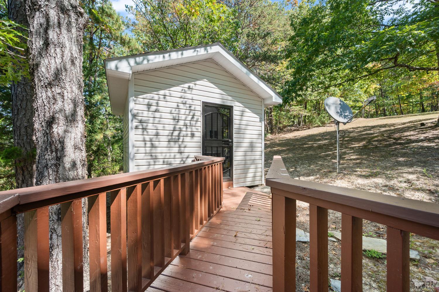 1451 Trellis Ridge Drive Lynch Station, VA 24571 - Photo 37 of 42 a view of a wooden deck and a yard