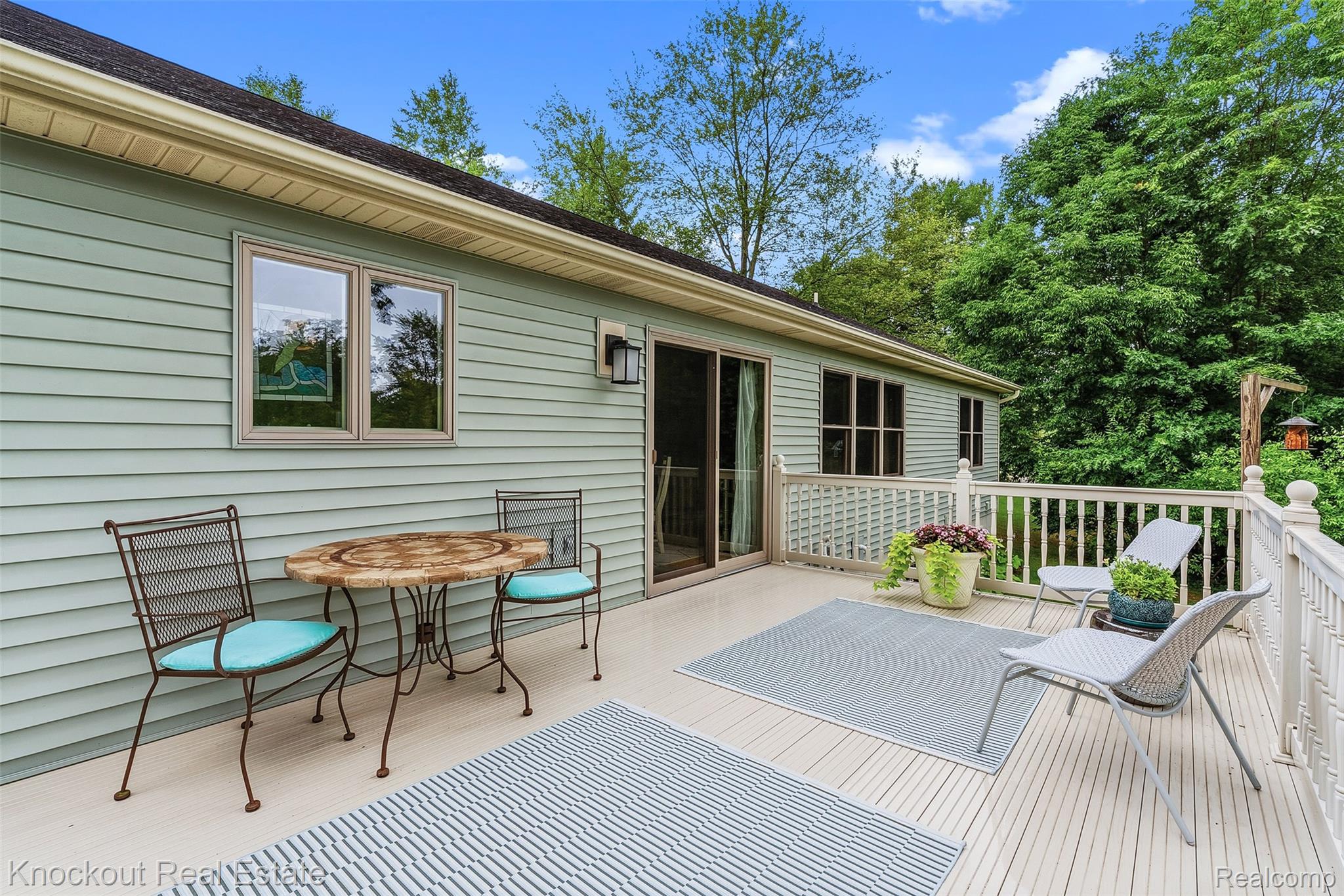 8436 Birch Run Road Millington, MI 48746 - Photo 37 of 44 Expansive exterior deck featuring durable composite flooring and white balusters