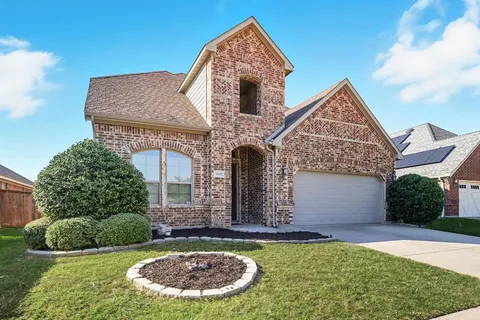 a view of an empty room with window and bathroom