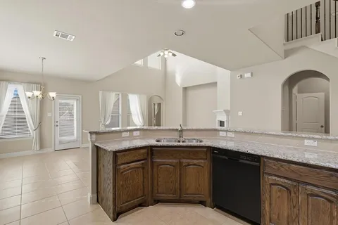 a view of an empty room with a ceiling fan