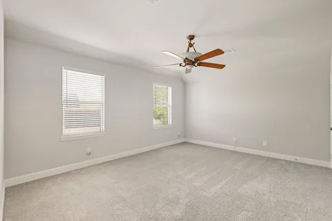 a bathroom with a sink a toilet a tub and shower