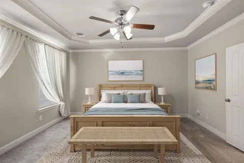 a bedroom with a bed and window