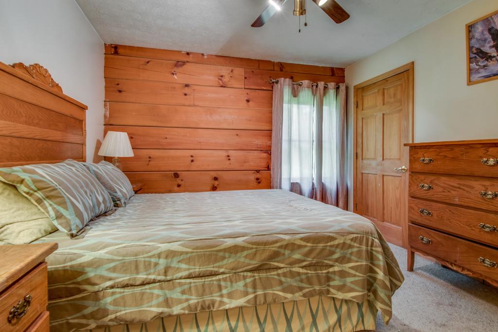 6815 Williams Road Cross Plains, TN 37049 - Photo 11 of 26 a bedroom with a bed and a dresser