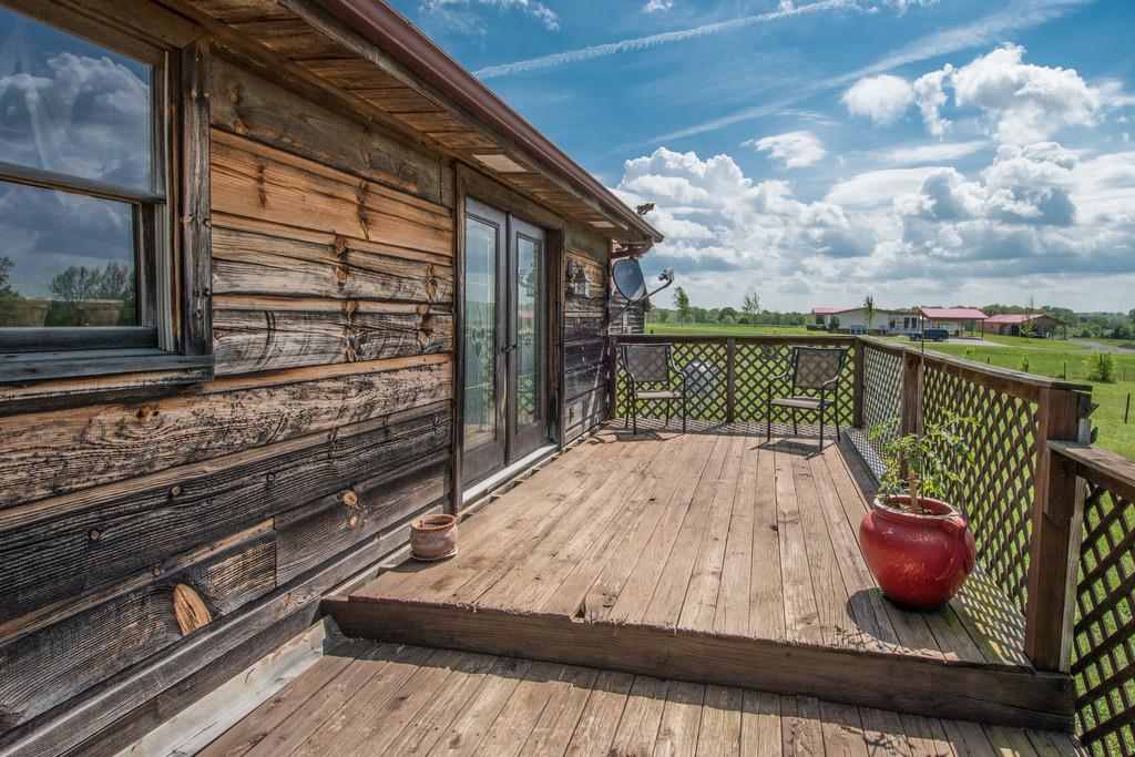 6815 Williams Road Cross Plains, TN 37049 - Photo 19 of 26 a view of balcony with wooden floor and seating space