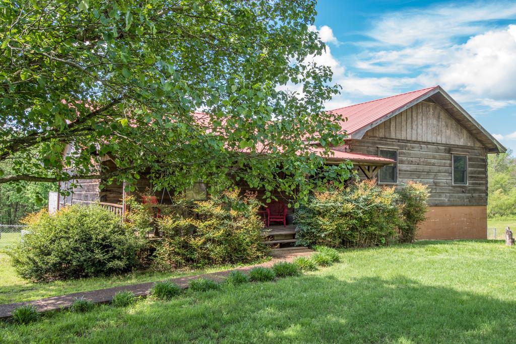 6815 Williams Road Cross Plains, TN 37049 - Photo 3 of 26 a front view of a house with a yard