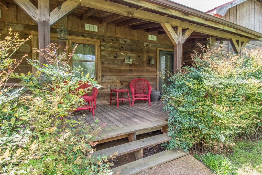 6815 Williams Road Cross Plains, TN 37049 - Photo 4 of 26 a view of a wooden door with a bench in patio