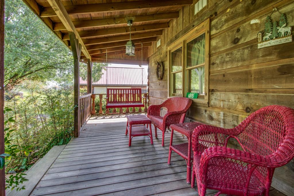 6815 Williams Road Cross Plains, TN 37049 - Photo 5 of 26 a view of a porch with furniture and a yard