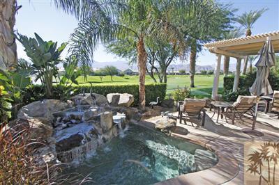 80555 Knightswood Road Indio, CA 92201 - Photo 1 of 25 a view of a patio with table and chairs potted plants and palm tree