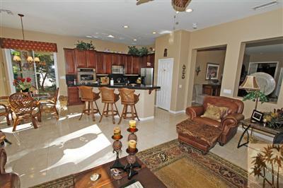 80555 Knightswood Road Indio, CA 92201 - Photo 13 of 25 a living room with lots of furniture and kitchen view