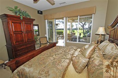 80555 Knightswood Road Indio, CA 92201 - Photo 15 of 25 a bed sitting in a bedroom next to a window