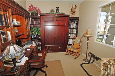 80555 Knightswood Road Indio, CA 92201 - Photo 19 of 25 a room with furniture a rug and a window
