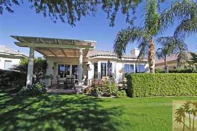 80555 Knightswood Road Indio, CA 92201 - Photo 2 of 25 a front view of a house with garden