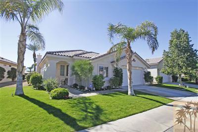 80555 Knightswood Road Indio, CA 92201 - Photo 3 of 25 a front view of a house with a garden