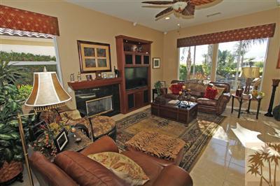 80555 Knightswood Road Indio, CA 92201 - Photo 8 of 25 a living room with furniture fireplace and a large window