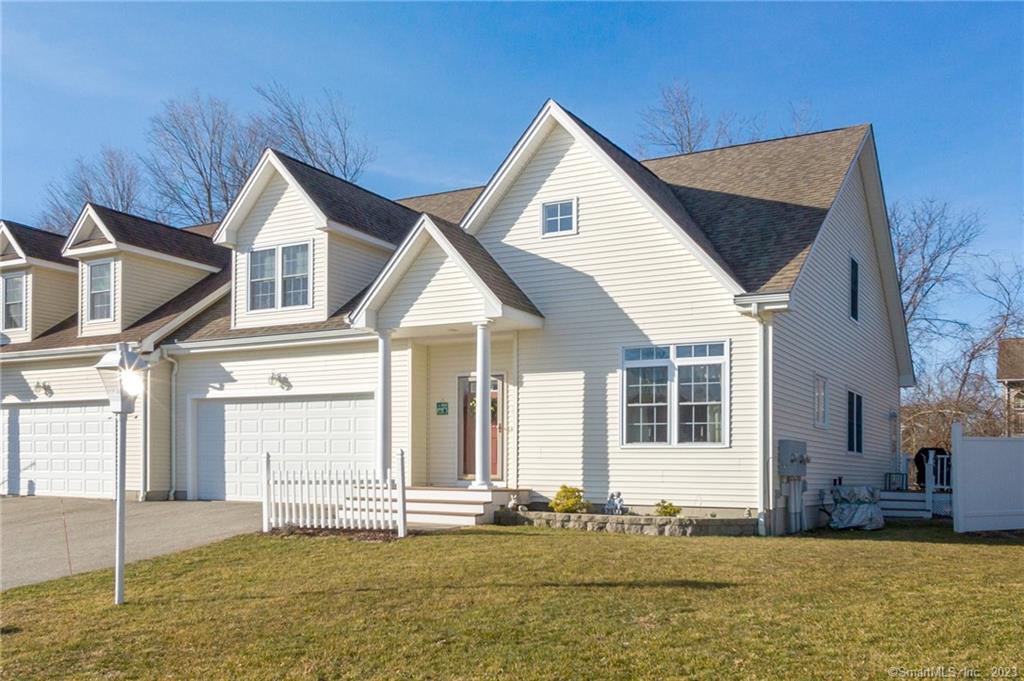 9 Chestnut Hollow Road, Unit 9 Colchester, CT 06415 - Photo 1 of 1 a view of a house with a yard