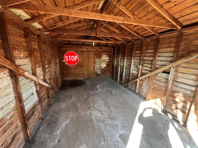 a view of a backyard with large trees
