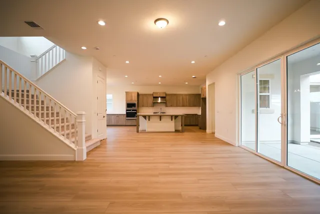 a view of kitchen with furniture and a refrigerator