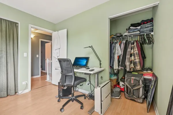 a view of a workspace with furniture and a bicycle