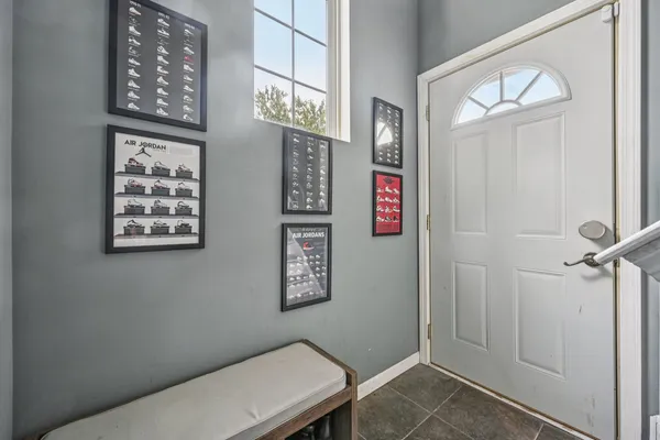 a view of a hallway with paintings on the wall