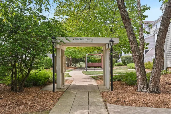 a picture of a park with an bench