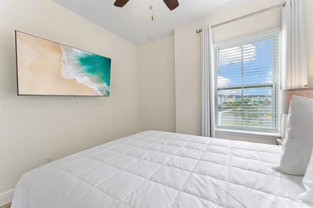 a front view of a house with a yard and potted plants