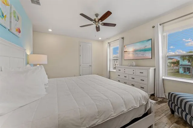 a front view of a house with garden and parking