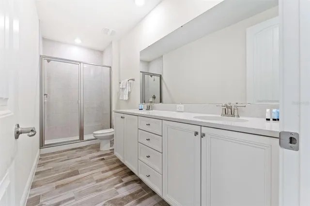 a view of residential houses with swimming pool and lake view