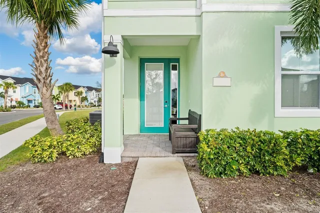 an aerial view of residential houses with outdoor space and river