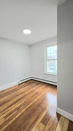 a bathroom with a sink mirror and toilet