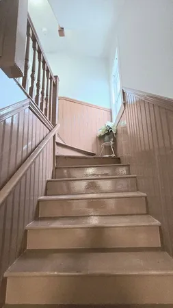 a view of a livingroom with furniture nad wooden floor