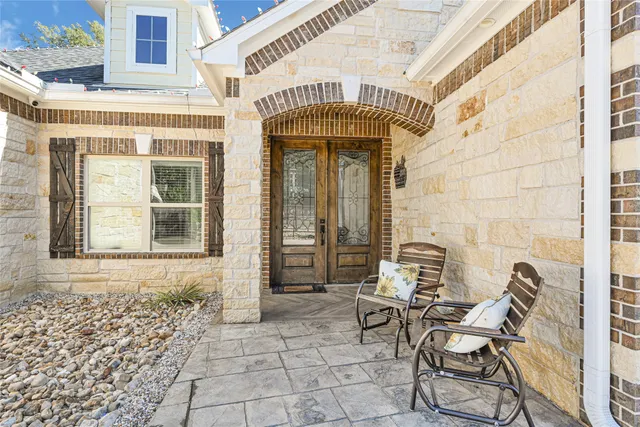 a front view of a building with outdoor seating