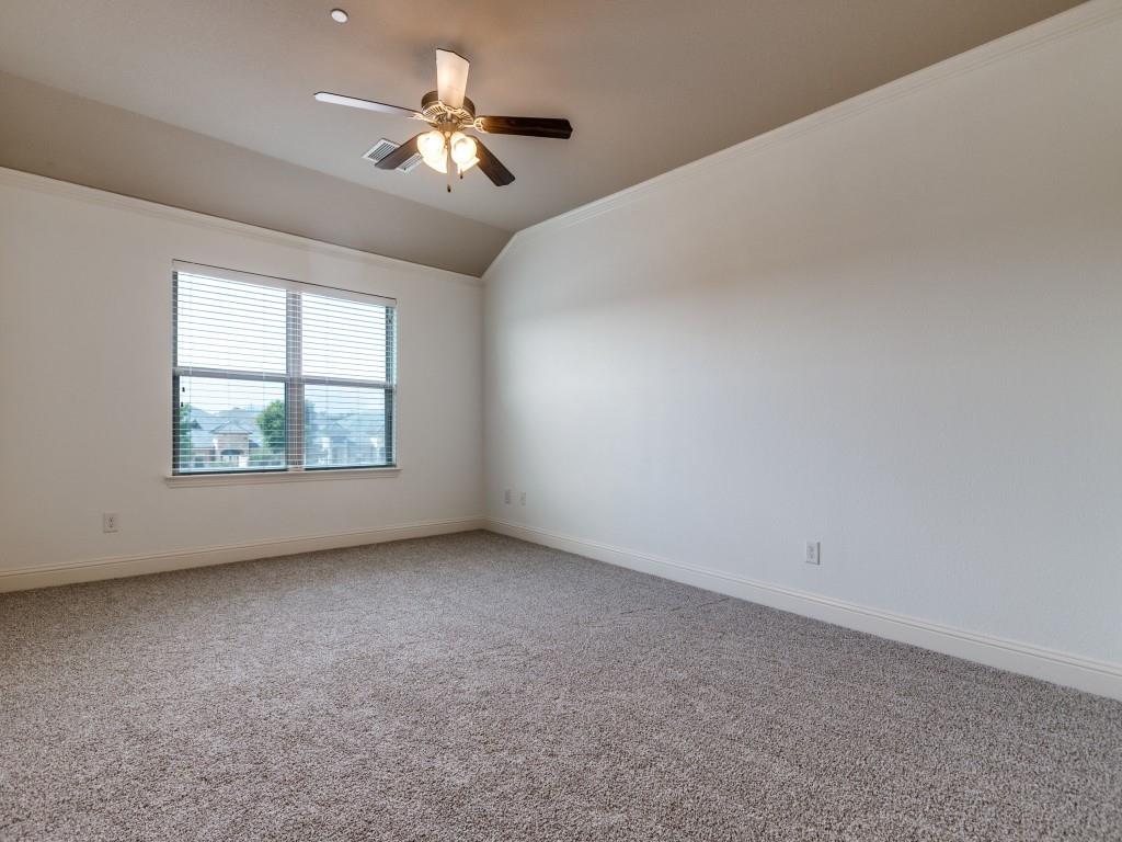 4696 Cecile Road Plano, TX 75024 - Photo 19 of 26 an empty room with windows and chandelier fan