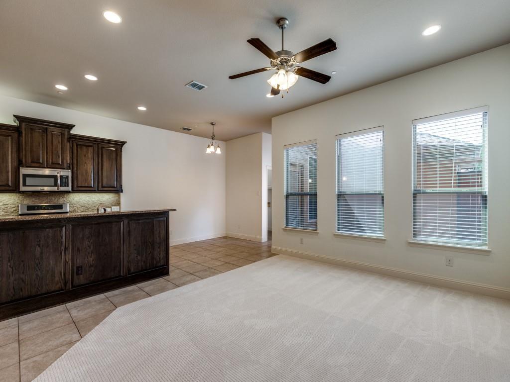 4696 Cecile Road Plano, TX 75024 - Photo 6 of 26 a view of an empty room with kitchen and a window