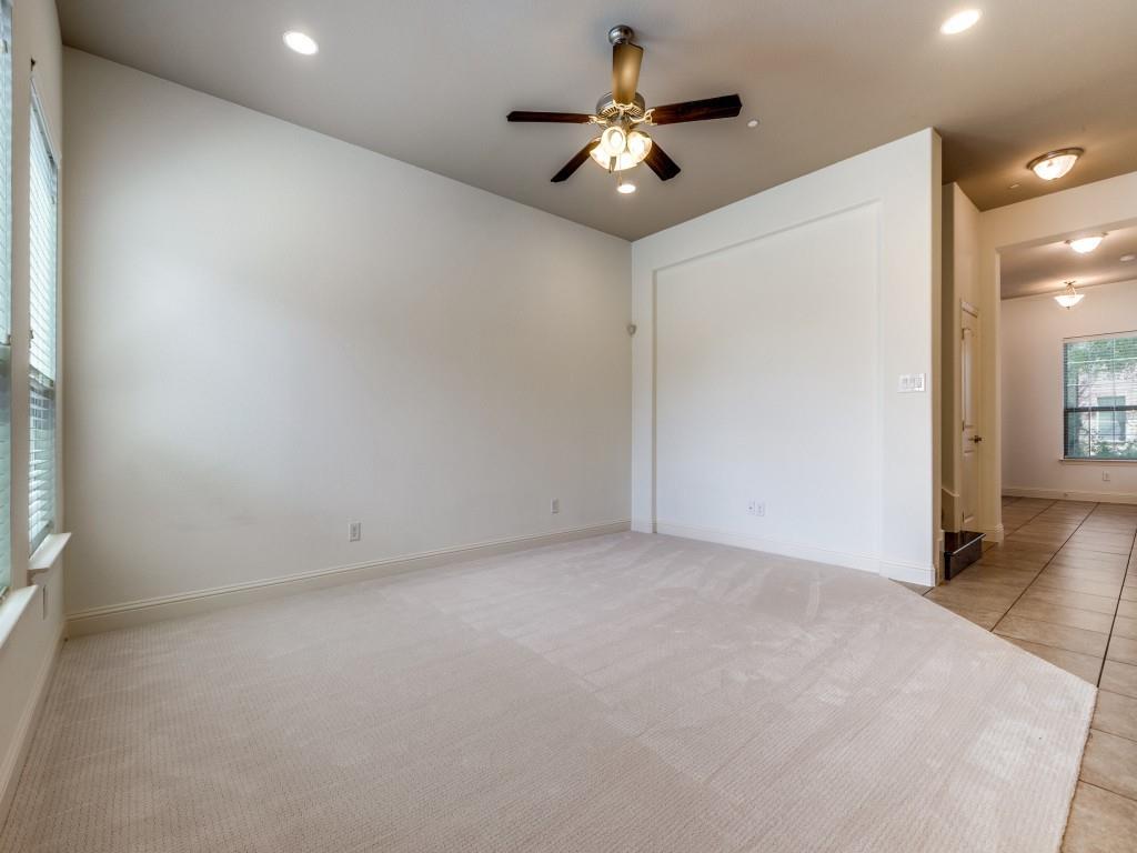 4696 Cecile Road Plano, TX 75024 - Photo 10 of 26 an empty room with a ceiling fan and a window