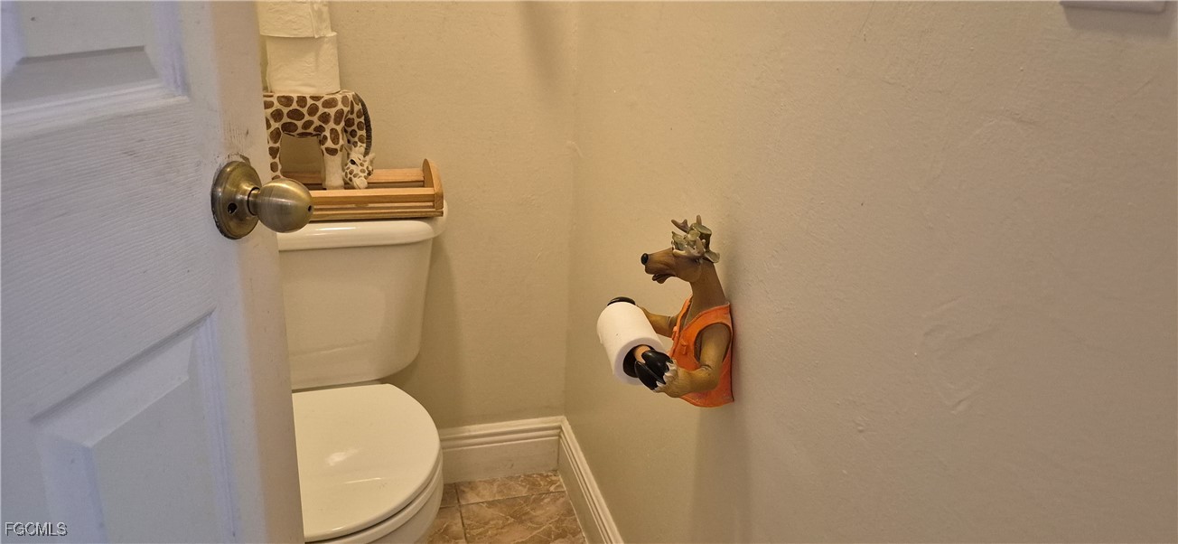 2011 Leroy Avenue Alva, FL 33920 - Photo 15 of 28 a bathroom with a toilet and a sink