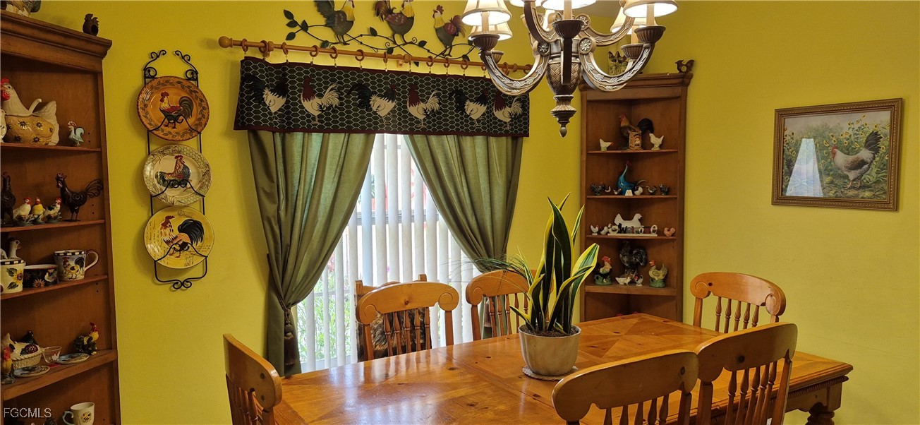 2011 Leroy Avenue Alva, FL 33920 - Photo 2 of 28 a dining room with furniture entryway and wooden floor