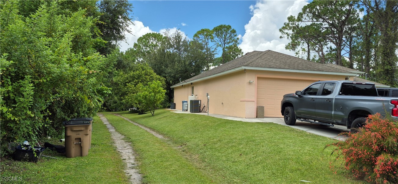 2011 Leroy Avenue Alva, FL 33920 - Photo 26 of 28 a view of a house with a yard