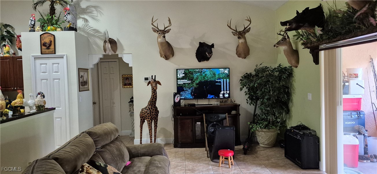 2011 Leroy Avenue Alva, FL 33920 - Photo 3 of 28 a living room with furniture and a potted plant