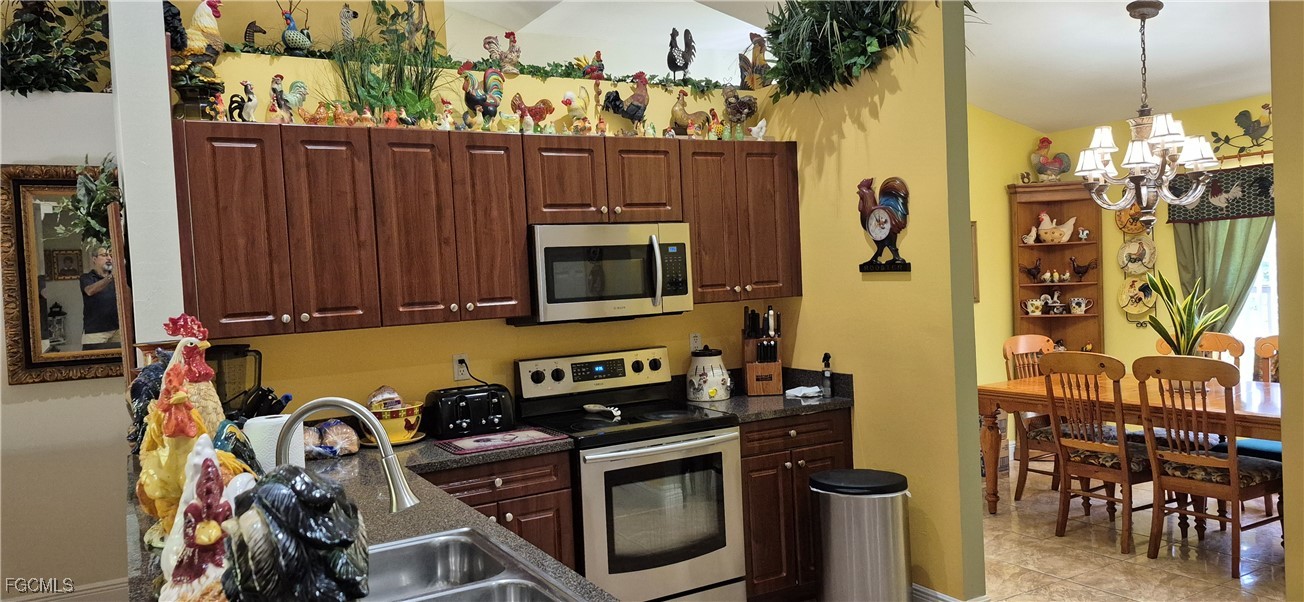2011 Leroy Avenue Alva, FL 33920 - Photo 5 of 28 a view of a kitchen with wooden floor and a fireplace
