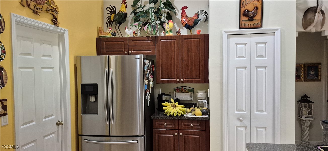 2011 Leroy Avenue Alva, FL 33920 - Photo 8 of 28 a kitchen with stainless steel appliances granite countertop a refrigerator and a stove