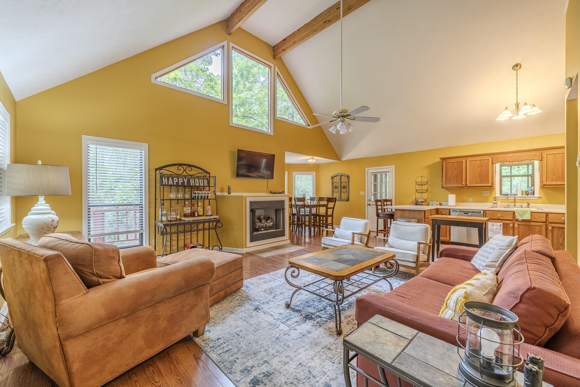 405 Murray Lane Counce, TN 38326 - Photo 8 of 36 a living room with furniture a fireplace and a flat screen tv