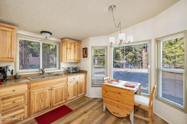 a spacious bathroom with a granite countertop tub sink and mirror