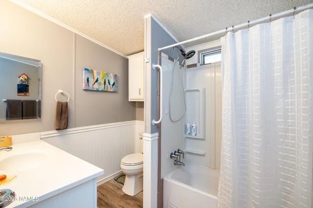 a bathroom with a sink a bathtub and a shower
