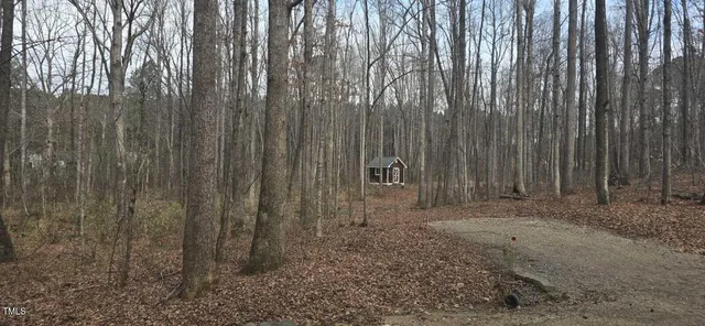 a view of a outdoor space with a wooden fence