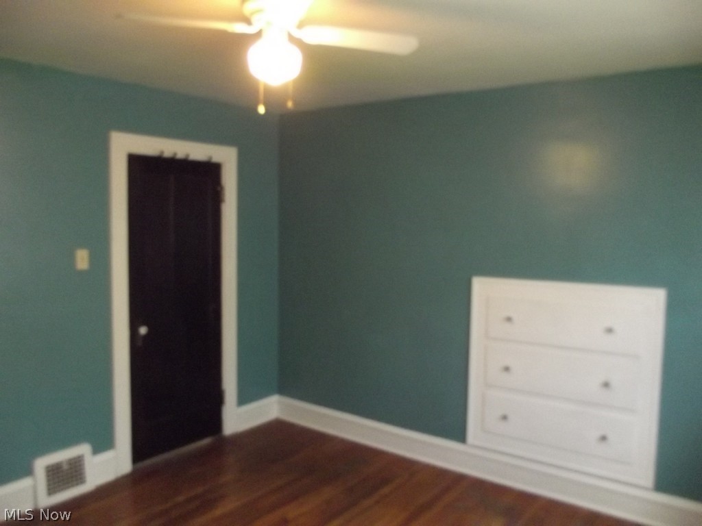 3363 Berea Road Cleveland, OH 44111 - Photo 29 of 50 Spare room featuring dark hardwood / wood-style flooring and ceiling fan