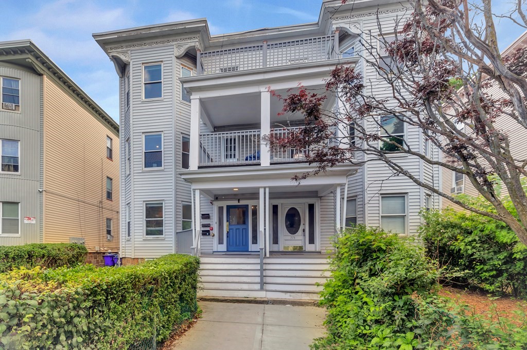 front view of a house with a garden