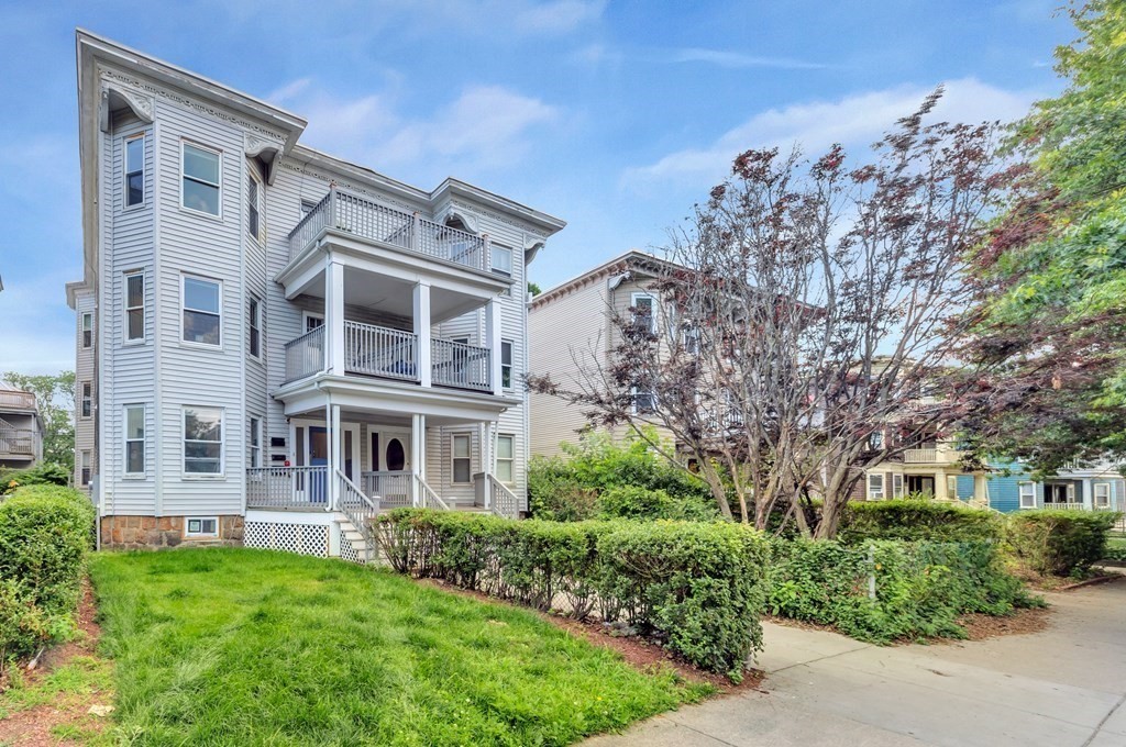 777 Columbia Road Boston, MA 02125 - Photo 25 of 39 front view of a house with a garden