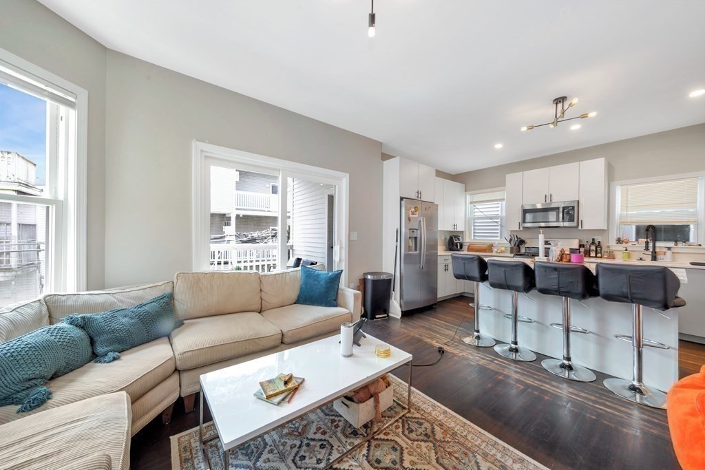 777 Columbia Road Boston, MA 02125 - Photo 29 of 39 a living room with furniture and a window